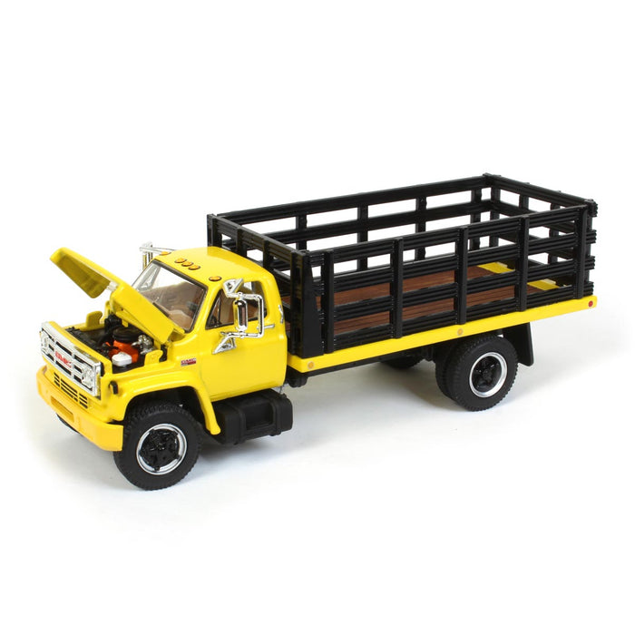 1/64 GMC 6500 Stake Bed, Yellow with Black Stakes, First Gear Exclusive