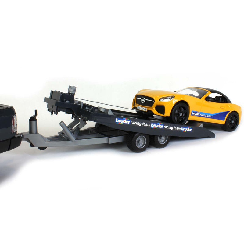 1/16 RAM 2500 Pickup with Yellow Racing Team  Roadster by Bruder