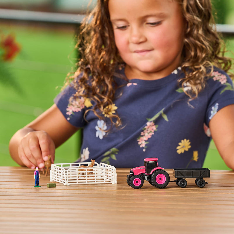 1/64 Case IH 10-Piece Farm Toy Set by ERTL: Pink Tractor, Barge Wagon, Horses, Fence, Farmer, & Bale