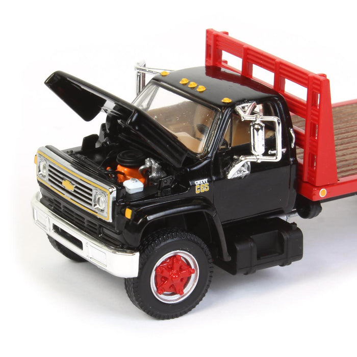 1/64 Black Chevy C65 Single Axle Truck with Red Flatbed, DCP by First Gear