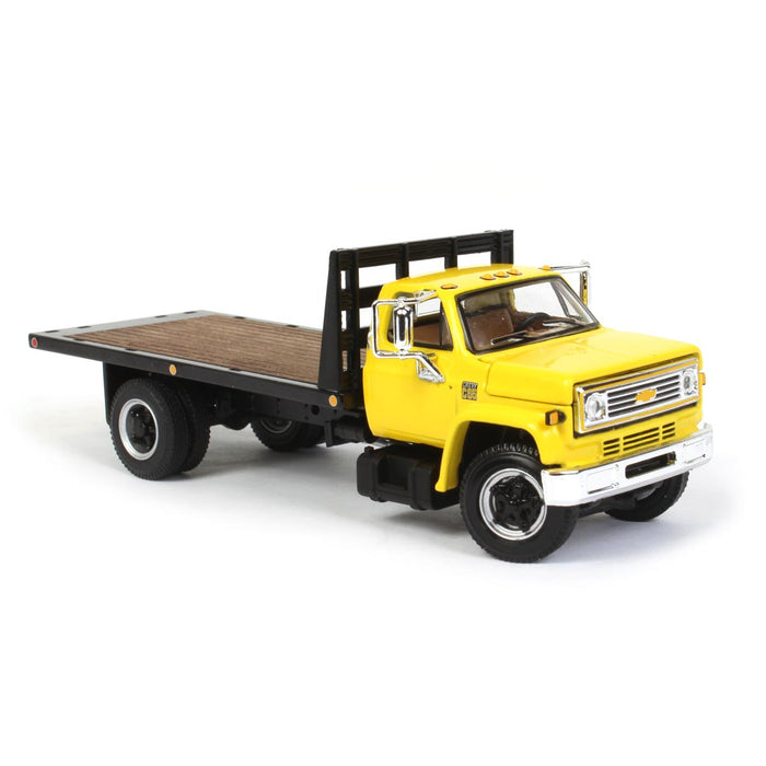 1/64 Yellow Chevy C65 Single Axle Truck with Black Flatbed, DCP by First Gear