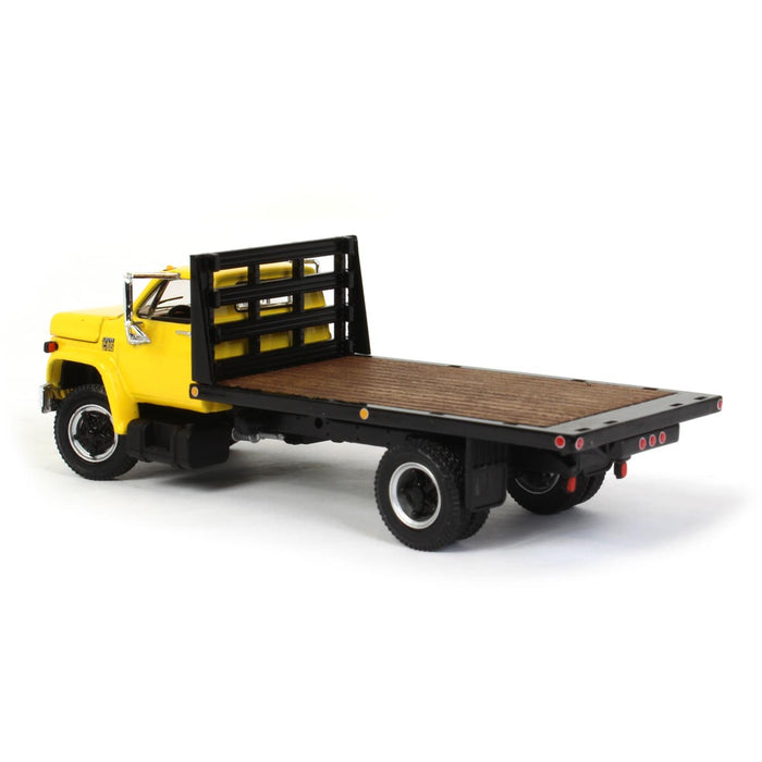 1/64 Yellow Chevy C65 Single Axle Truck with Black Flatbed, DCP by First Gear