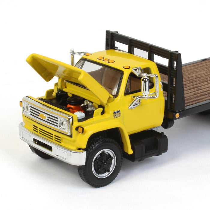 1/64 Yellow Chevy C65 Single Axle Truck with Black Flatbed, DCP by First Gear