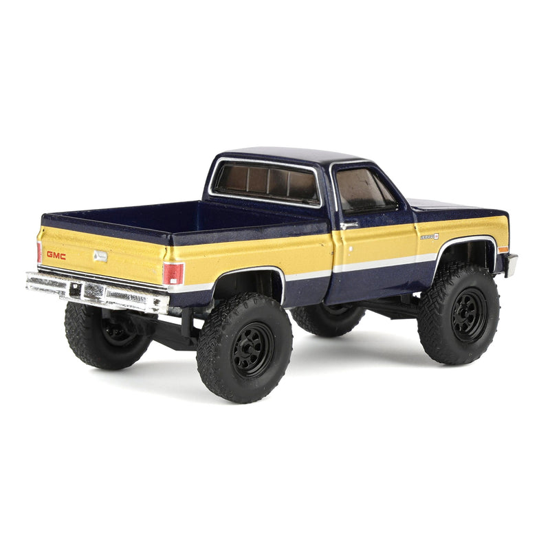 1/64 Lifted 1987 GMC K2500 High Sierra Pickup Truck, Stone Blue Metallic & Gold Dealer Exclusive by GreenLight Collectibles