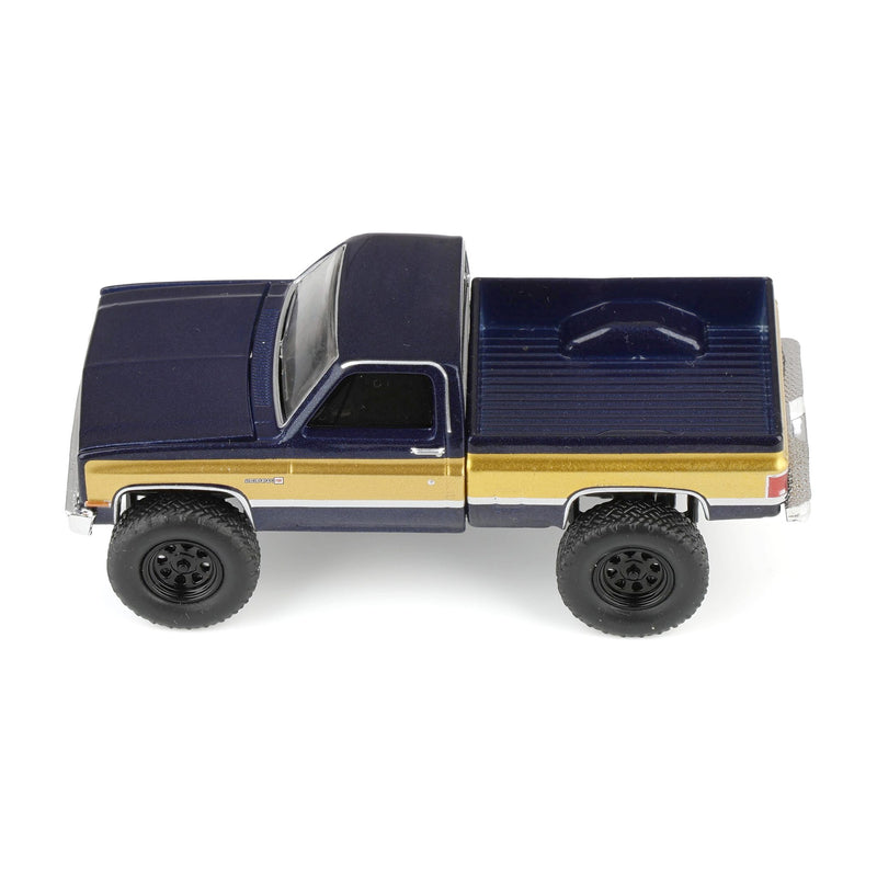 1/64 Lifted 1987 GMC K2500 High Sierra Pickup Truck, Stone Blue Metallic & Gold Dealer Exclusive by GreenLight Collectibles