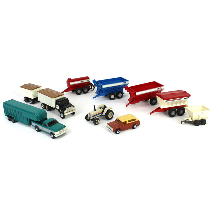 Lot of 1/64 (1) Tractor, (1) Grain Truck, (1) Pickup with Livestock Trailer, (1) Scout Traveler, and (6) Farm Implements