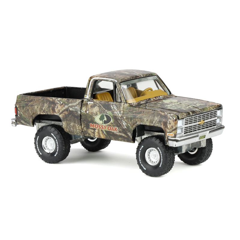 1/64 1983 Chevy Silverado Lifted Pickup Truck with Mossy Oak Accent by Big Country & Auto World