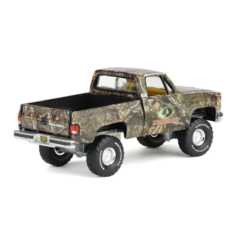 1/64 1983 Chevy Silverado Lifted Pickup Truck with Mossy Oak Accent by Big Country & Auto World