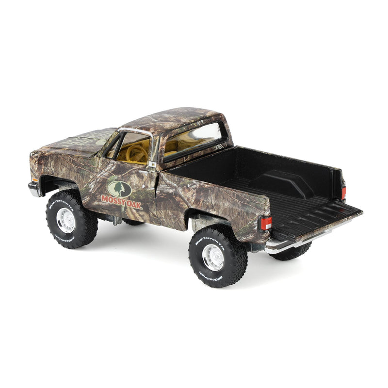 1/64 1983 Chevy Silverado Lifted Pickup Truck with Mossy Oak Accent by Big Country & Auto World