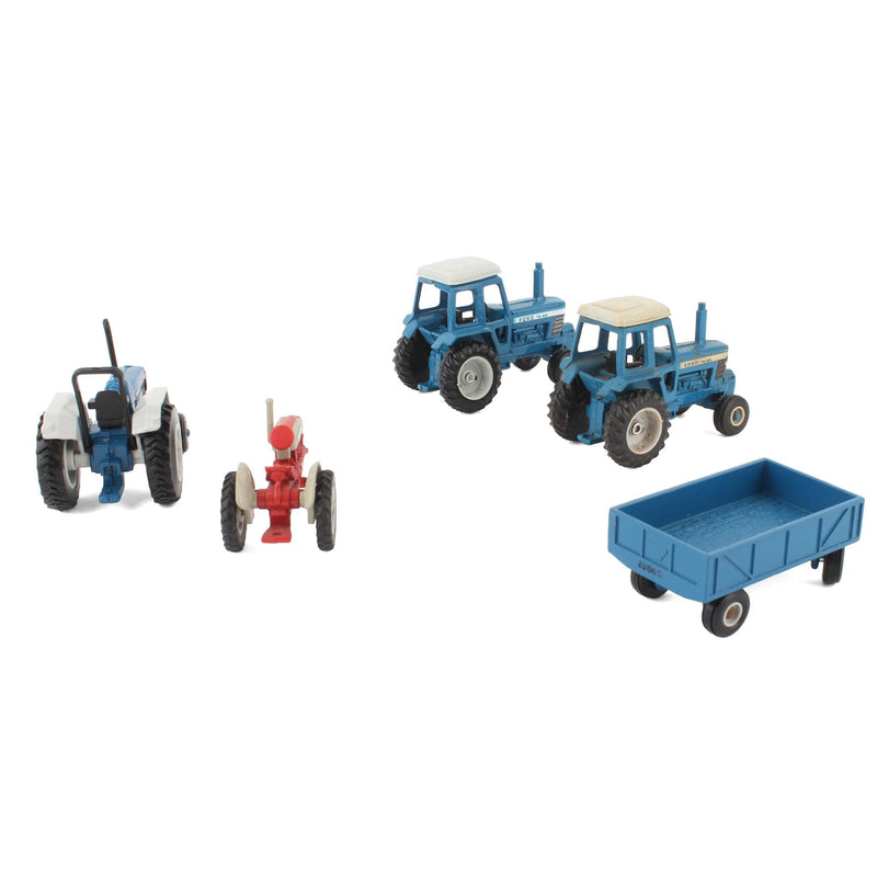 Lot of (4) 1/64 Ford Tractors and (1) 1/64 Blue Barge Wagon by ERTL