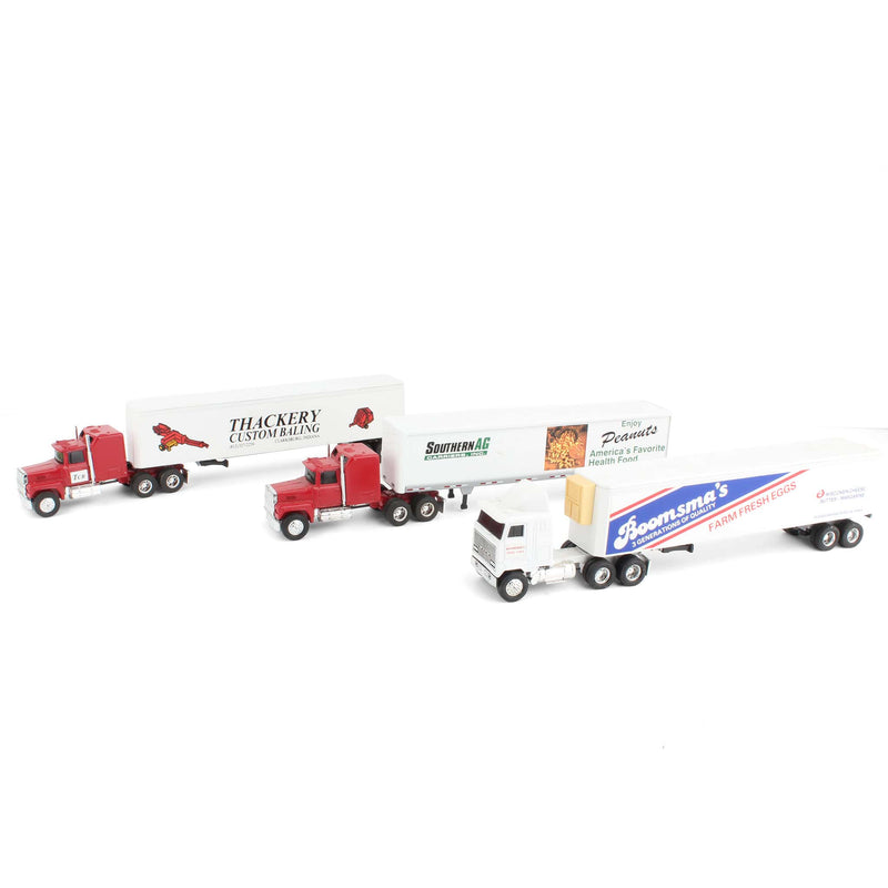 Lot of (2) 1/64 Ford Semi Trucks, (1) 1/64 Mack Semi Truck, and (3) Box Trailers