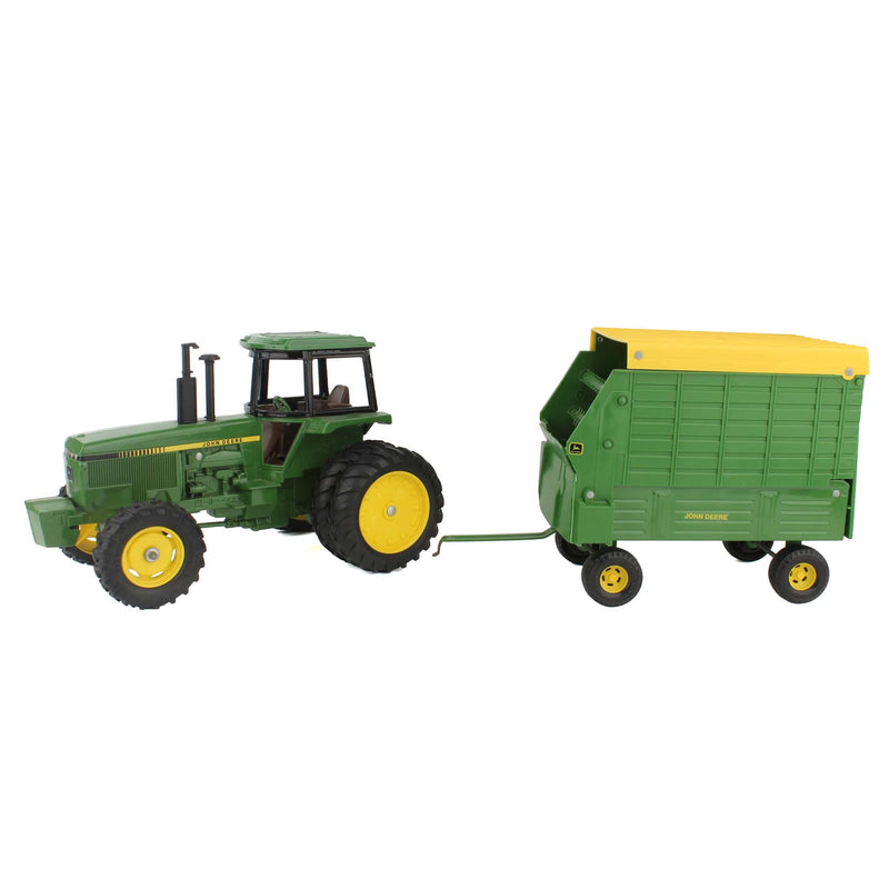Lot of (1) 1/16 John Deere 4850 Tractor and (1) 1/16 John Deere Forage Wagon by ERTL