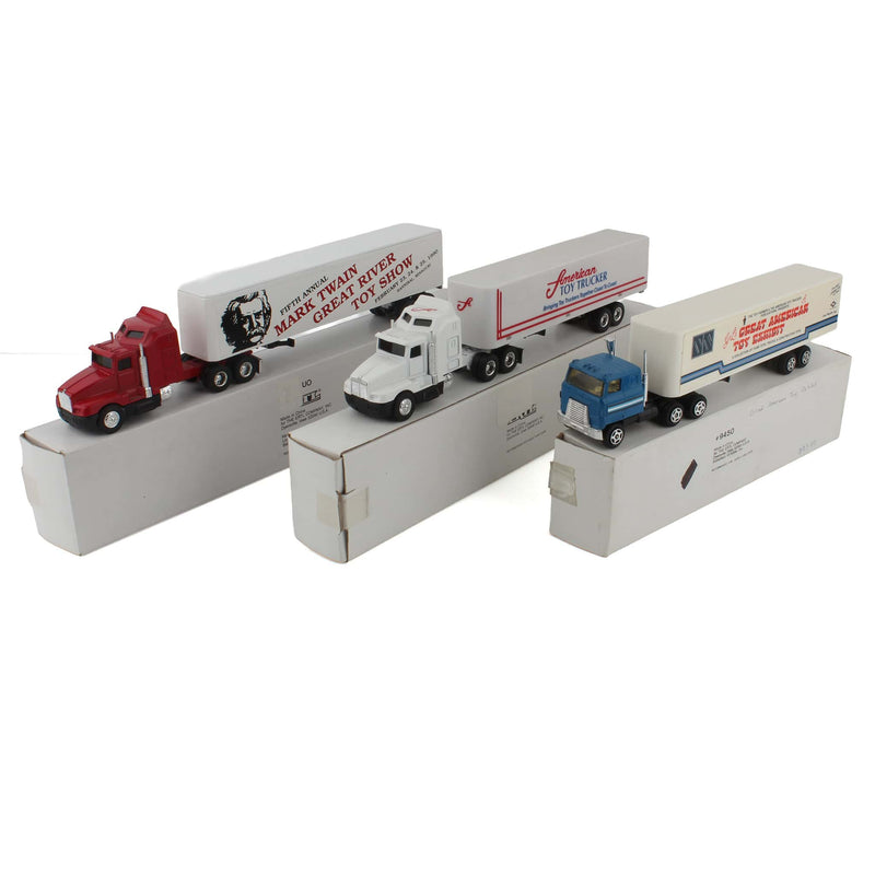 Lot of (1) 1/64 American Toy Trucker Semi, (1) 1/64 Great American Toy Exhibit Semi, and (1) 1/64 Mark Twain Great River Toy Show Semi